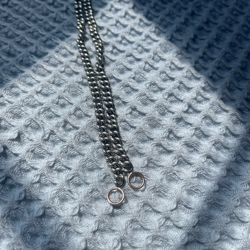 Marla Aaron curb chain stealing silver and rose gold hoops
